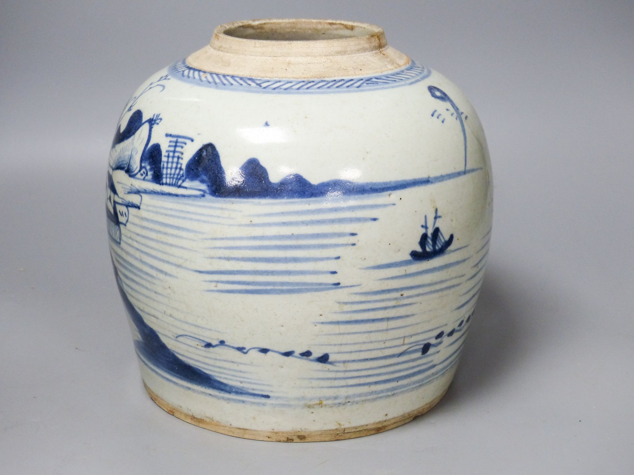 A 19th century Chinese blue and white jar, 20.5 cm high, of squat baluster form, seascape decoration (damage) 20cm